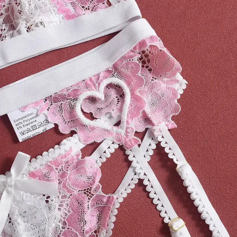 embroidered lace and care label on the pink garter belt