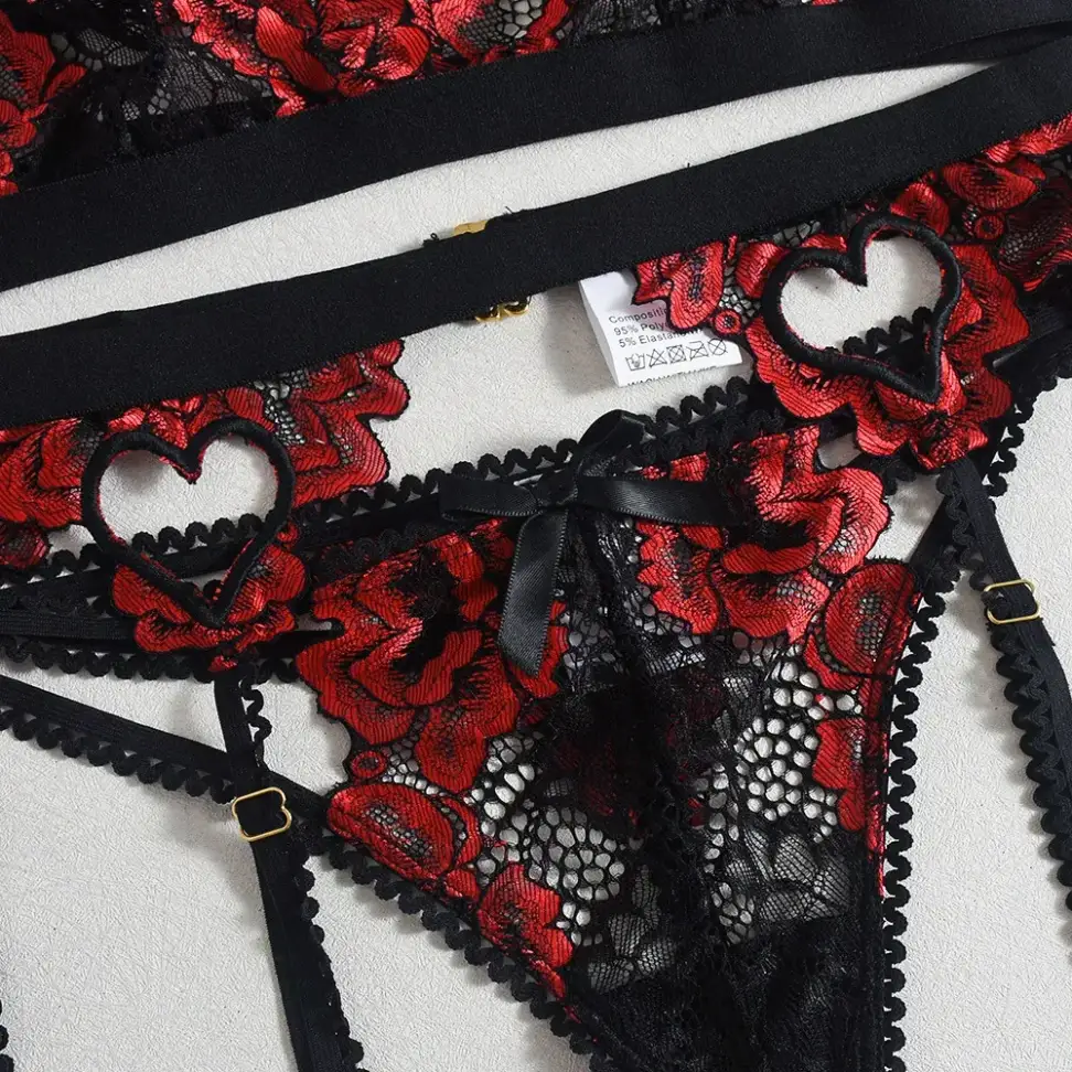heart cutout on the red embroidered garter belt
