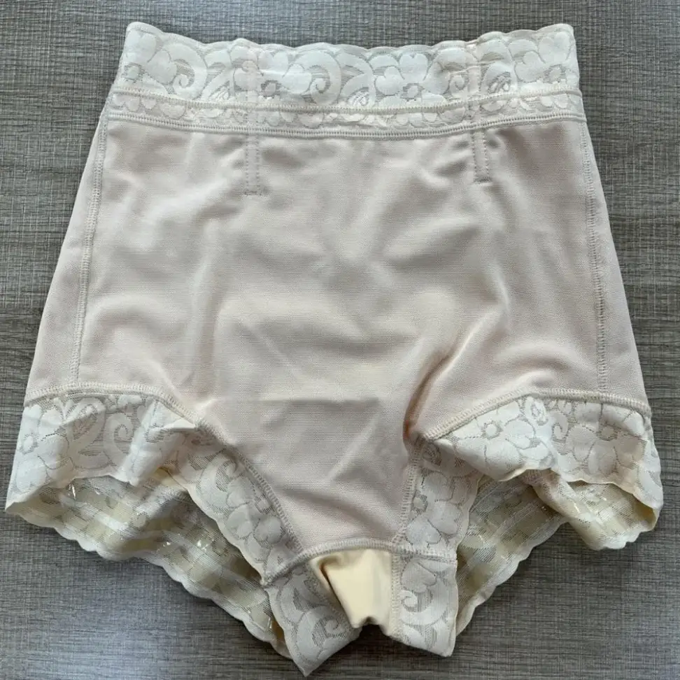 Inside view of the lace trim shaper shorts laid flat